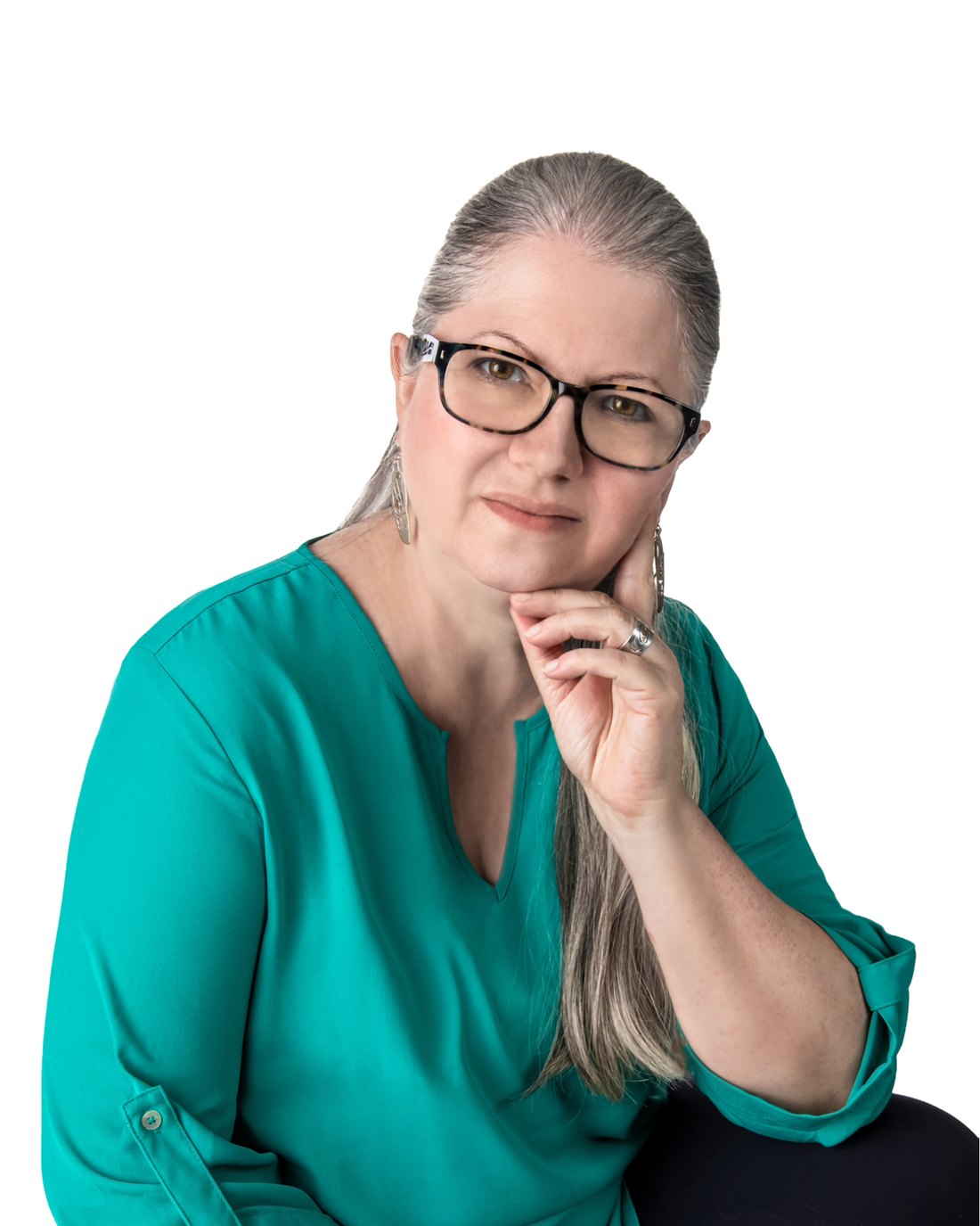 Darlene Hildebrandt, resting her chin on one hand, looking at the camera.